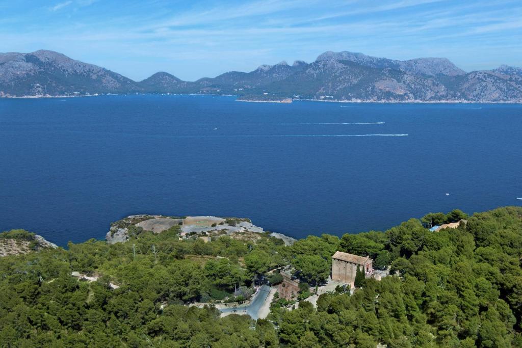 an island in the middle of a large body of water at Petit Hotel Hostatgeria La Victoria in Alcudia