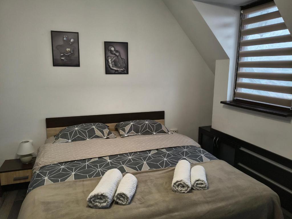 a bedroom with two beds and a window at Pleven View in Pleven