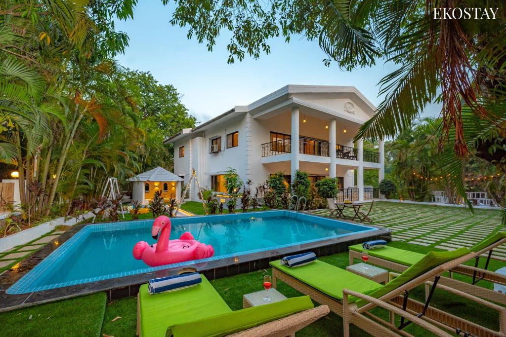 a pool in the backyard of a house at Ekostay Luxe - CASA SIA - Ideal for Big Groups- Poker Table in Lonavala
