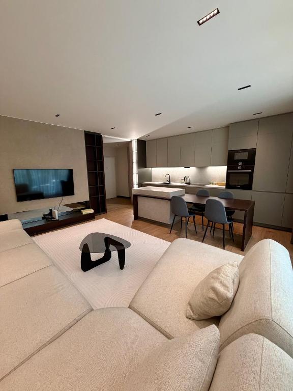 a large living room with a couch and a table at Skyline Exclusive 2 in Peje