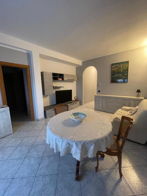 a living room with a table and a couch at La Vanitas in Cremona