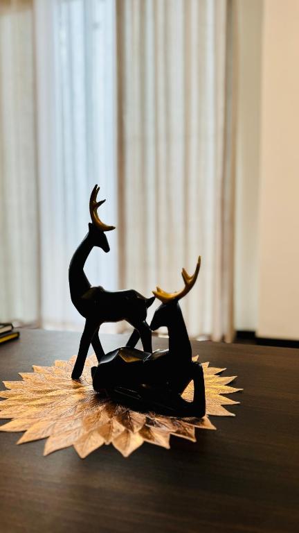 a figurine of a man and a woman sitting on a star at Misty5 in Pattipola