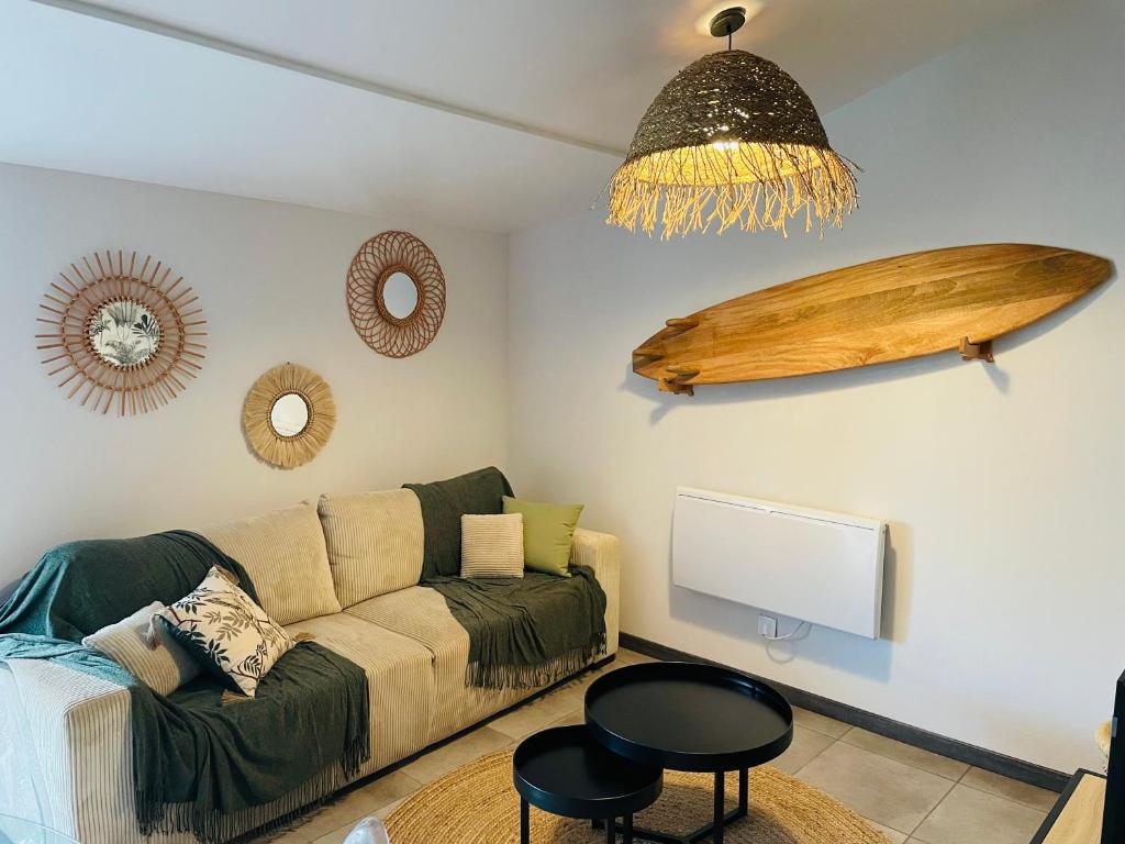 a living room with a couch and a flat screen tv at L entre deux charentes in Montils
