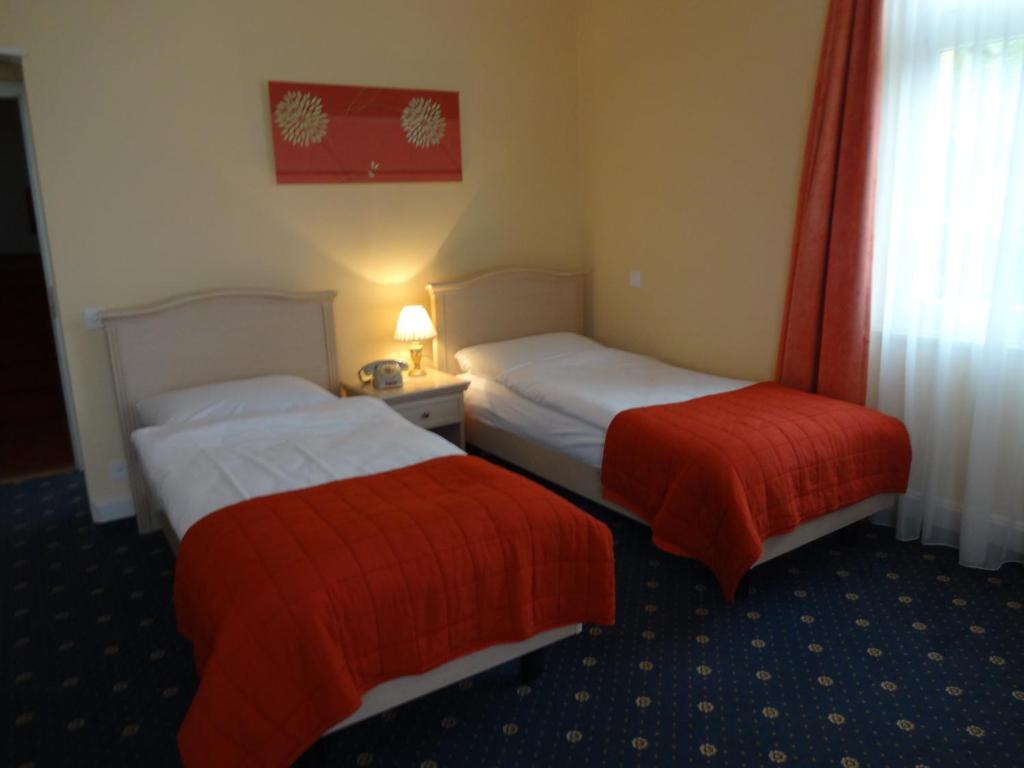 Postel nebo postele na pokoji v ubytování Hotel Schweizerhof