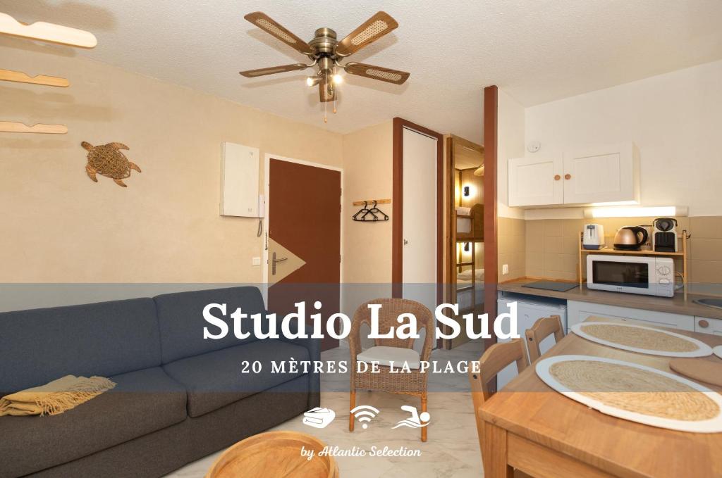 a living room with a couch and a table at Atlantic Selection - Studio La Sud - Piscine in Hossegor