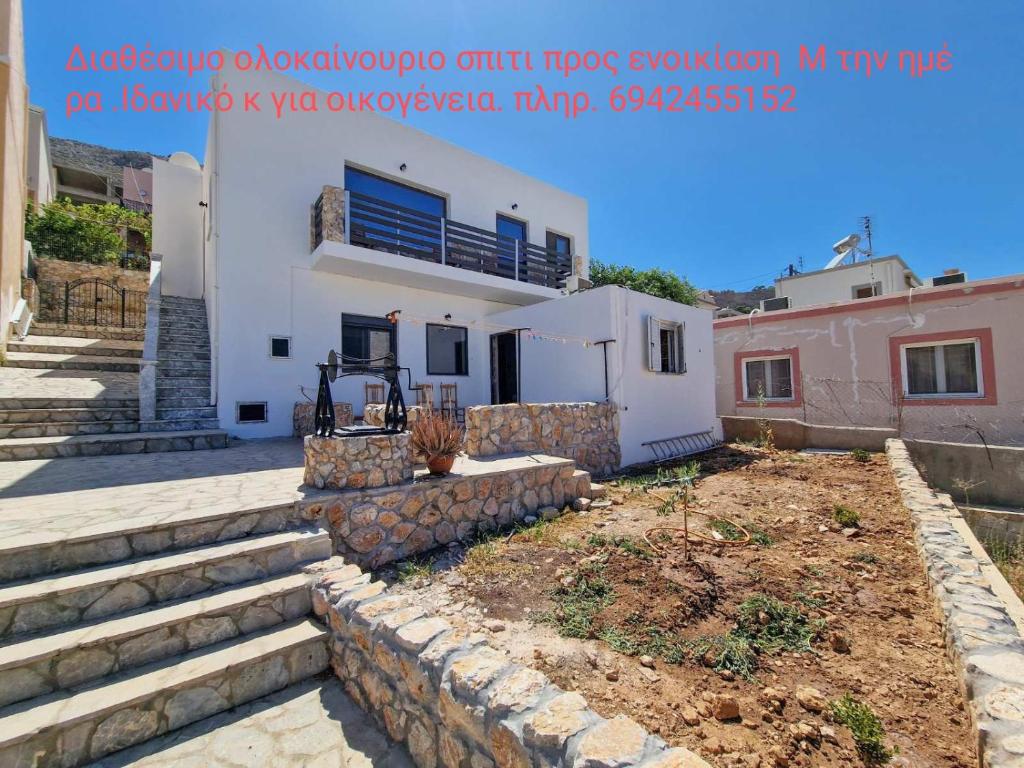 a house with stairs in front of it at family MARIA in Kalymnos