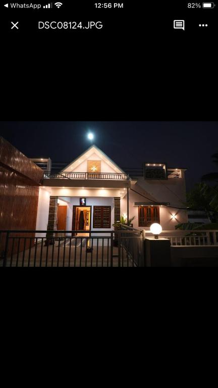 a house with a light on top of it at night at pathayil villa in Thekkady