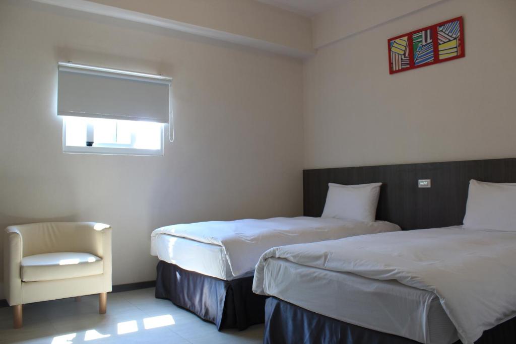 Postel nebo postele na pokoji v ubytování Sunnyside Hotel