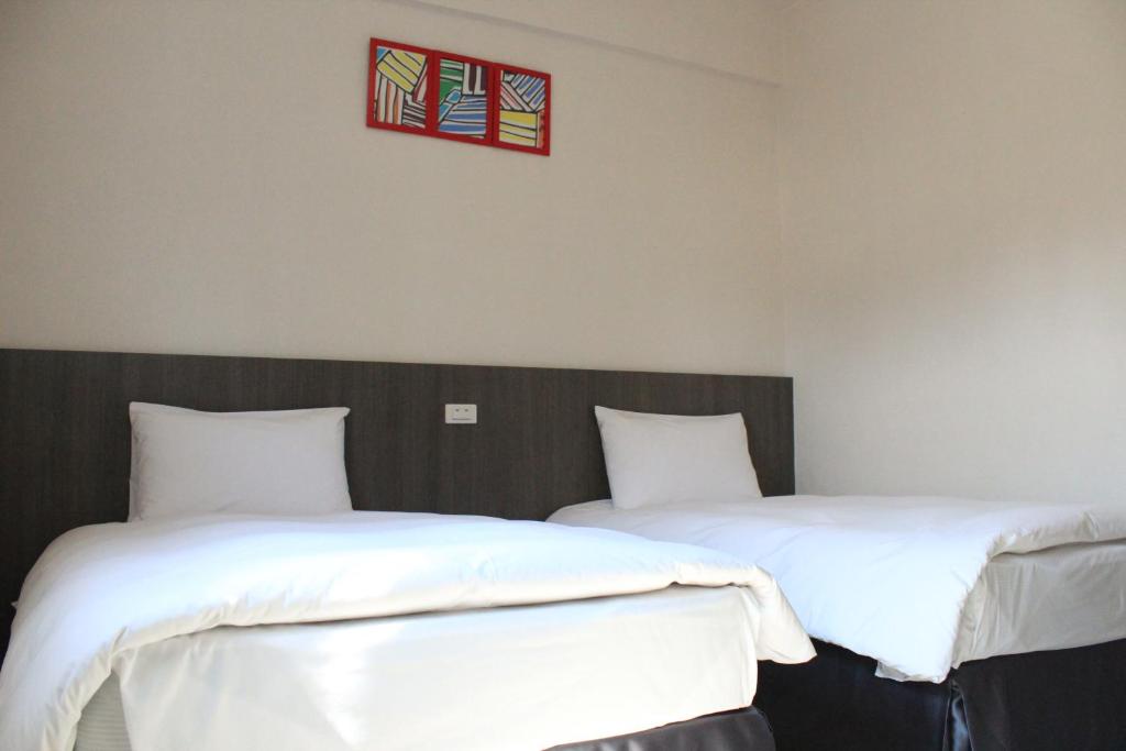 Postel nebo postele na pokoji v ubytování Sunnyside Hotel
