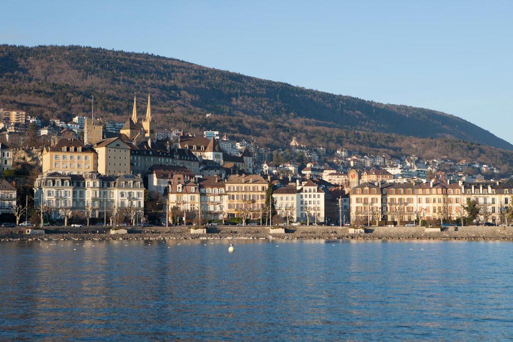 a city on the shore of a body of water at City centre with lake view in Neuchâtel