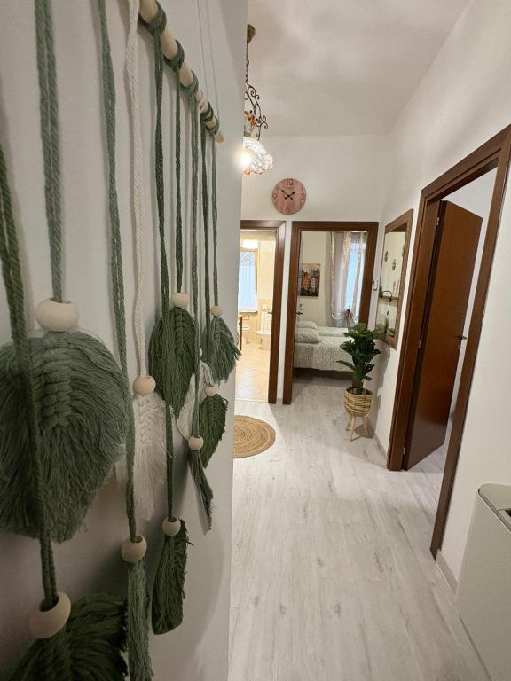 a living room with a wall with green plants at Nella Rosa in Monterotondo
