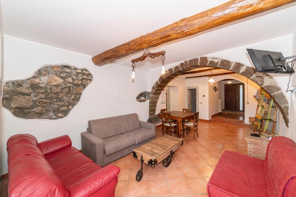 a living room with a couch and a table at La Casetta al Corso in Montefiascone
