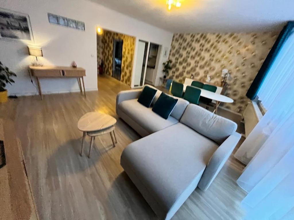 a living room with a couch and a table at Vilvoorde city center in Vilvoorde