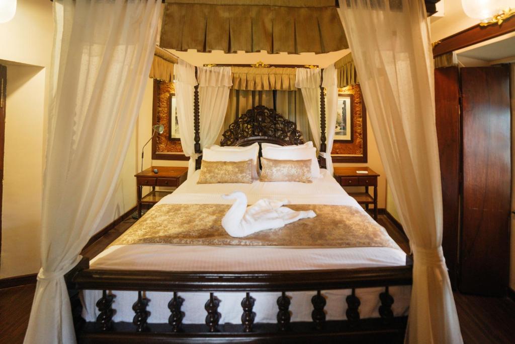 Postel nebo postele na pokoji v ubytování Casa Menezes - A Heritage Goan Homestay