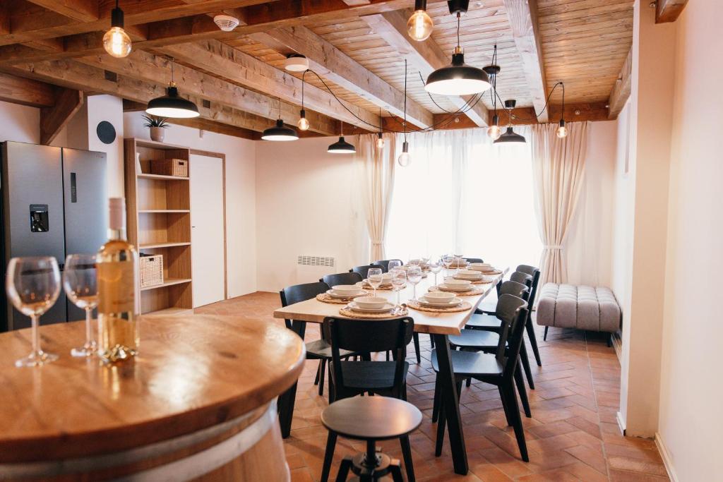a long dining room with a long table and chairs at Neobyčejný Sklep in Pavlov
