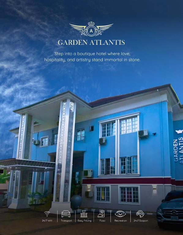 a picture of a blue building with the words garden atkinsocialmind into at Garden Atlantis Hotel in Enugu