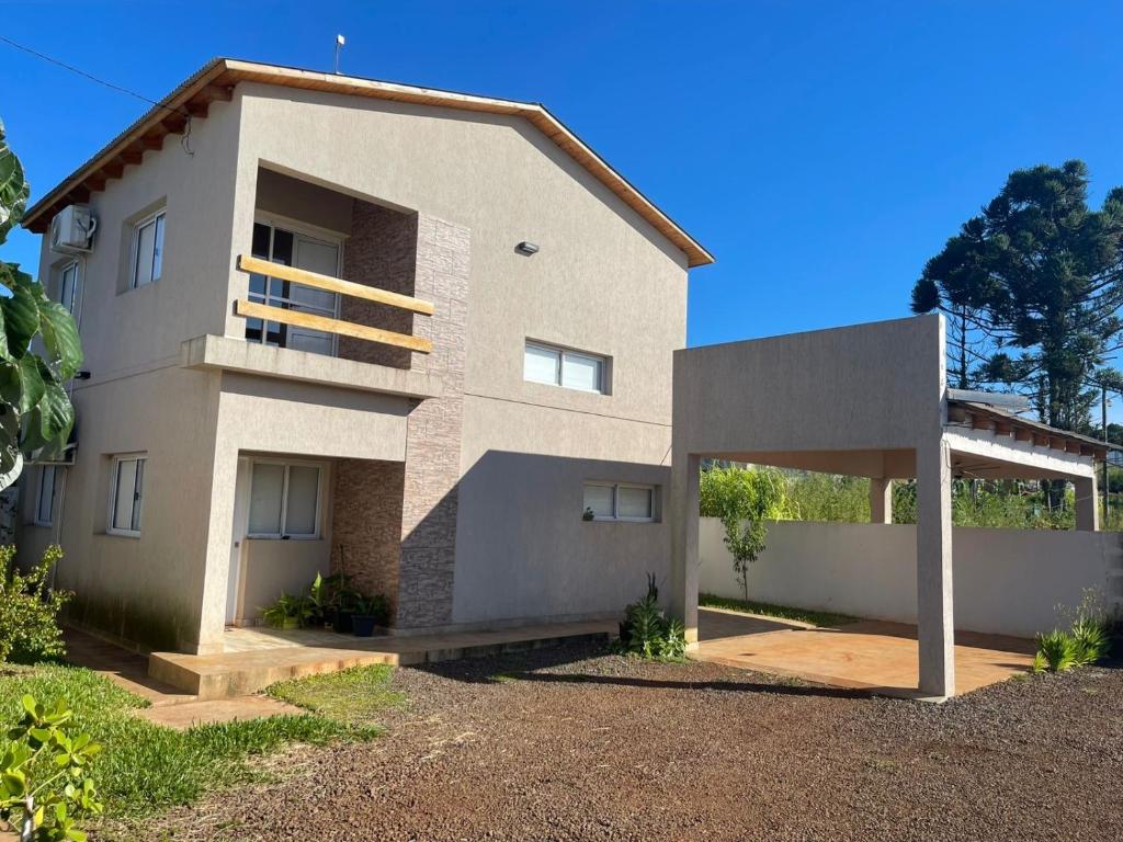 a large white house with a driveway at Tierra Roja in San Vicente