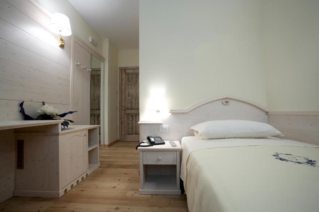 Postel nebo postele na pokoji v ubytování Giorgio e Flora Ristorante e Locanda