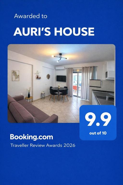 a living room with a couch and a table at AURI'S HOUSE in Vlorë