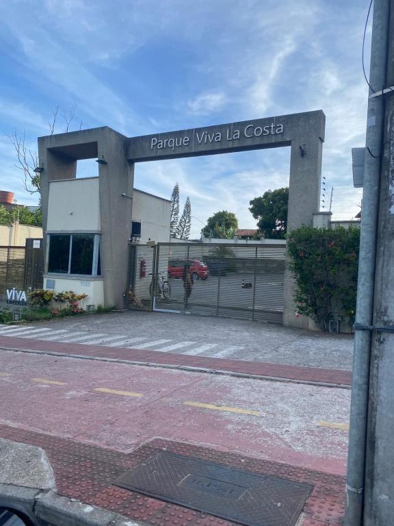 a building with a sign that reads private wine la costa at Ap Hostel For You in Serra