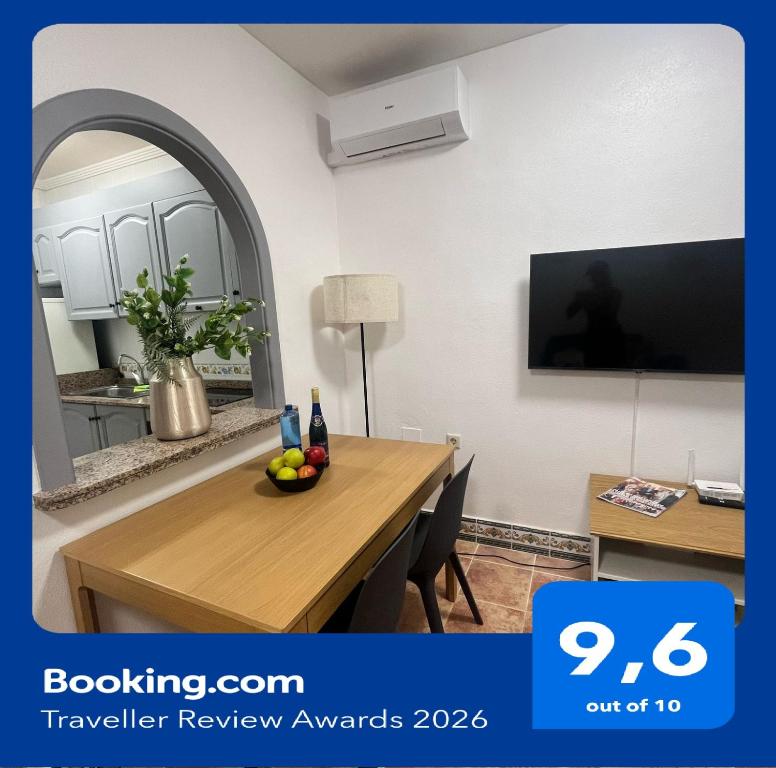 a dining room with a table with a bowl of fruit on it at Casa Brisa Mar in Gran Alacant