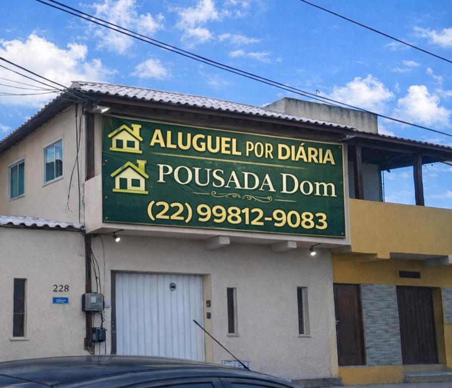a sign on the side of a building at Dom Antonio 3 in Campos dos Goytacazes