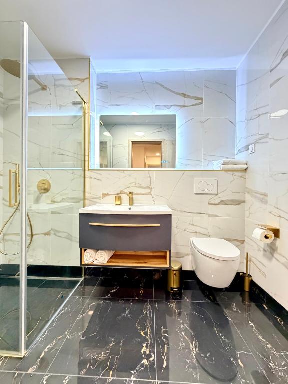 a bathroom with a sink and a toilet at GG Apartment 8 in Garmisch-Partenkirchen