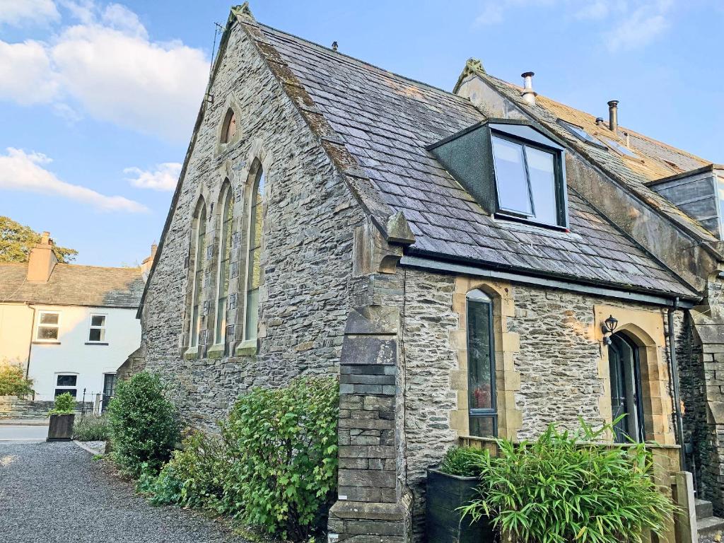 an old stone church with a window on it at The Chapel in Staveley
