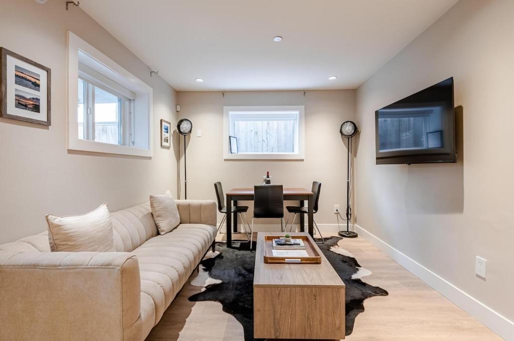 a living room with a couch and a table at Modern Bright Suite Self Check-In in North Vancouver