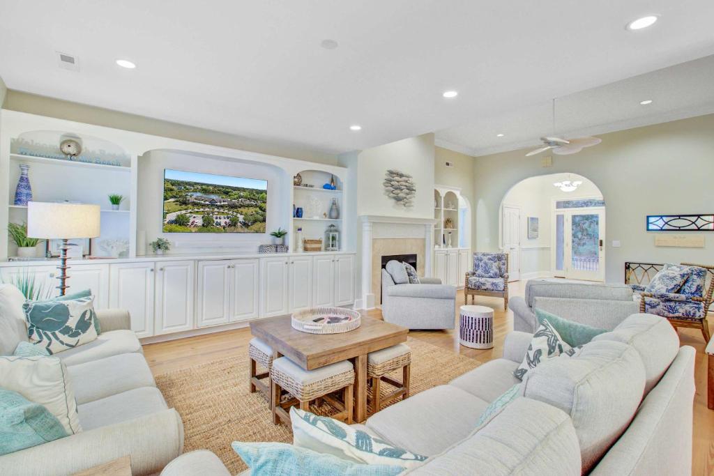 a living room with couches and a table at Baywood 3074 in Seabrook Island