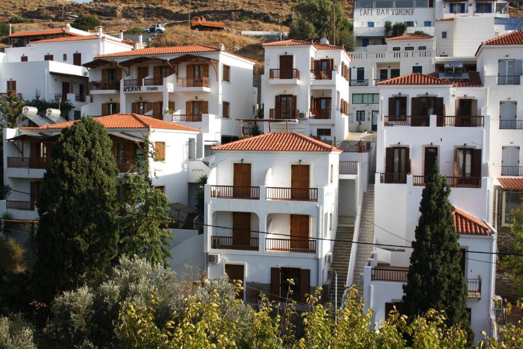 a group of white houses on a hill at Amorani Studios in Batsi