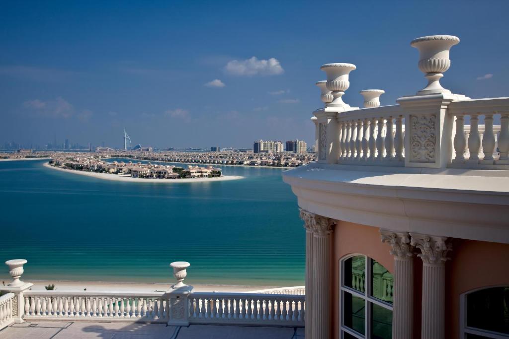 a balcony of a building with a view of the water at Kempinski Hotel Palm Jumeirah in Dubai
