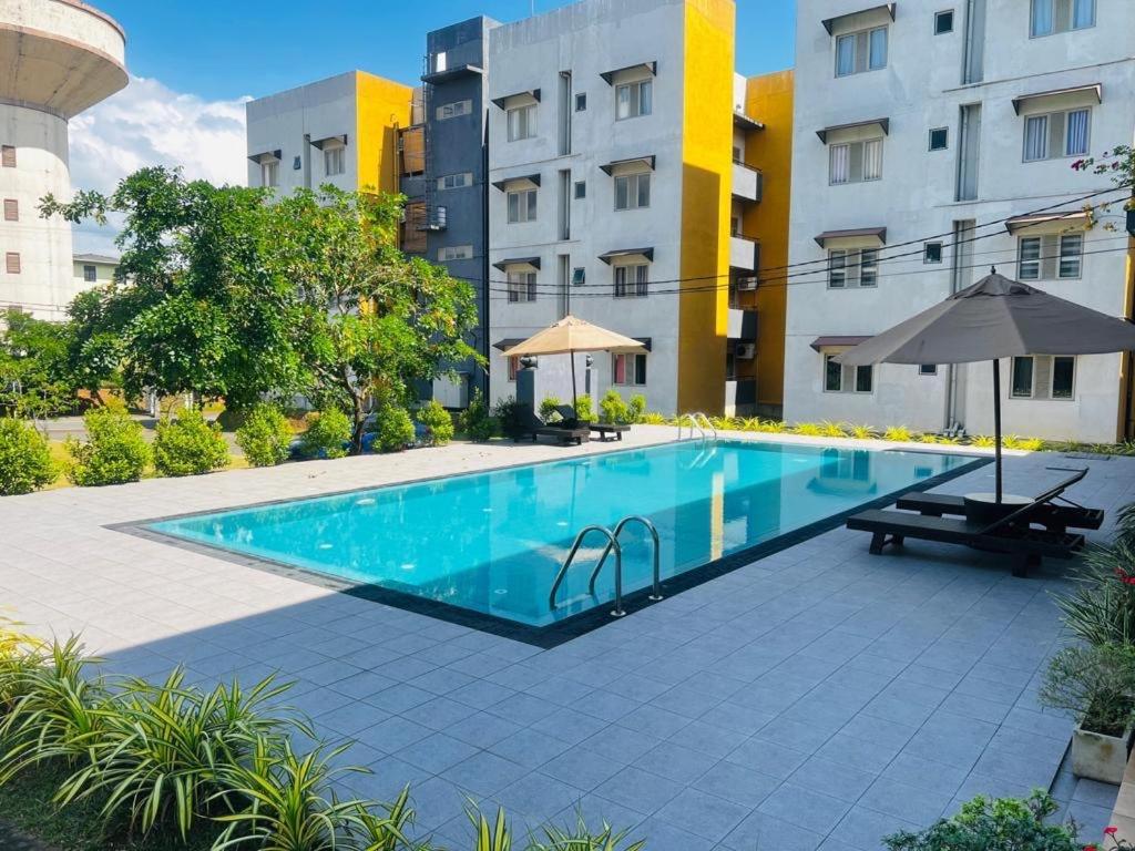 a swimming pool in the middle of a building at Apartment For Rent in Ambulgama