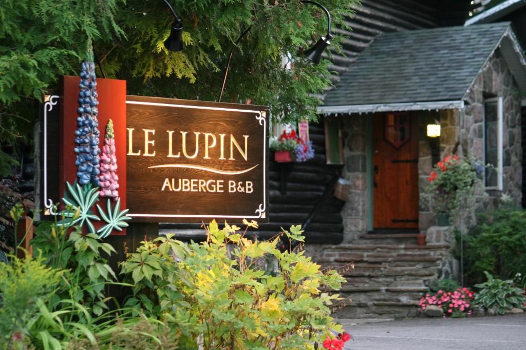 a building with a sign that reads ice lupin appliances bbb at Auberge Le Lupin-Self Check-in in Mont-Tremblant