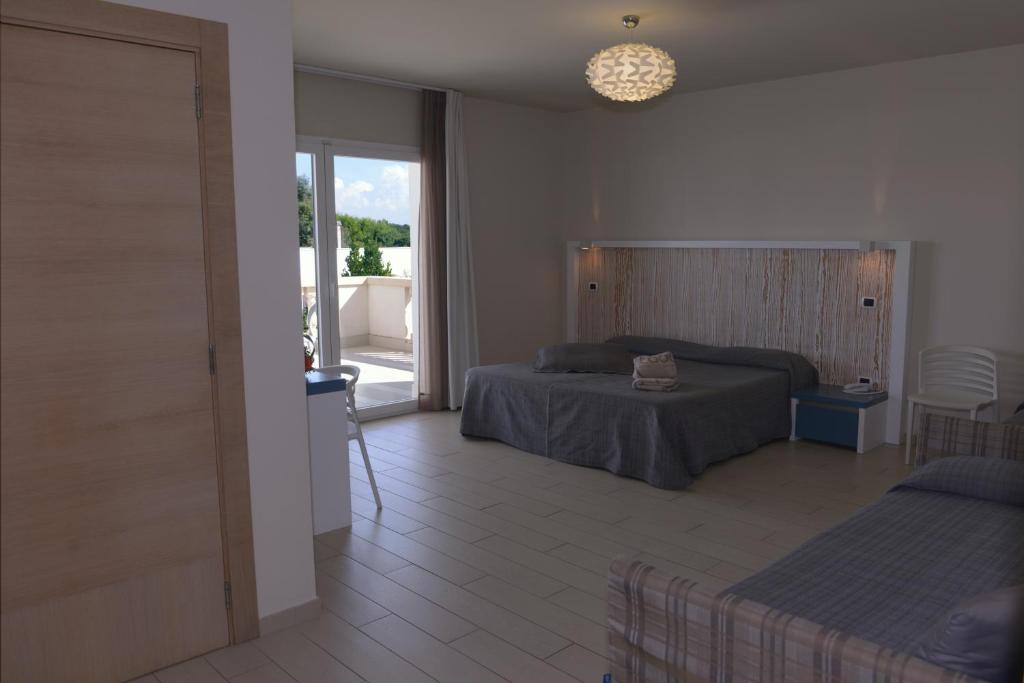 Postel nebo postele na pokoji v ubytování Tabù Hotel