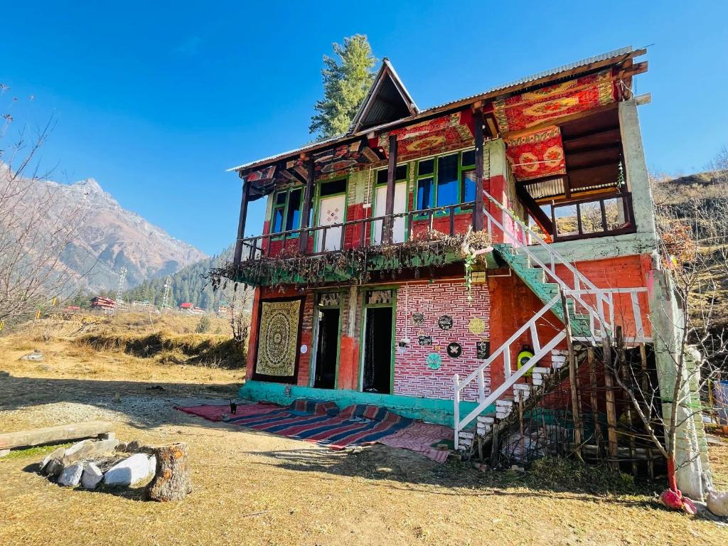 a building with a staircase in front of it at Mj home in Kalgha
