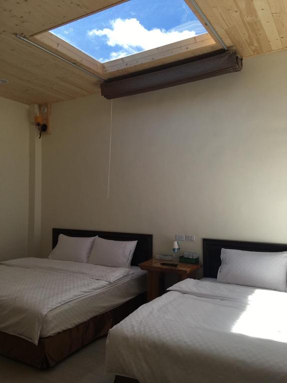 Postel nebo postele na pokoji v ubytování Taitung Sansiantai B&B