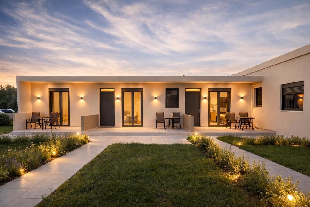 a modern house with a courtyard with lights at Sweven boutique apartments in Souda