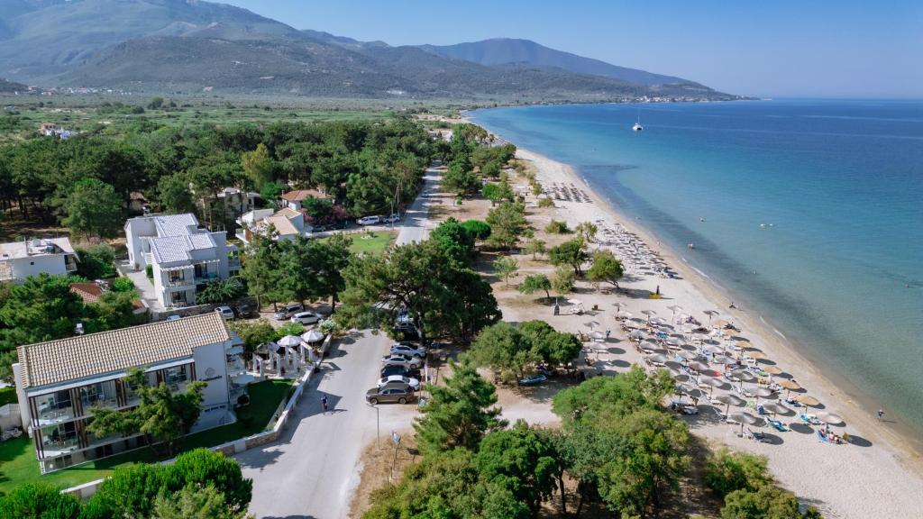 an aerial view of a beach with cars parked at Sentimento in Prinos