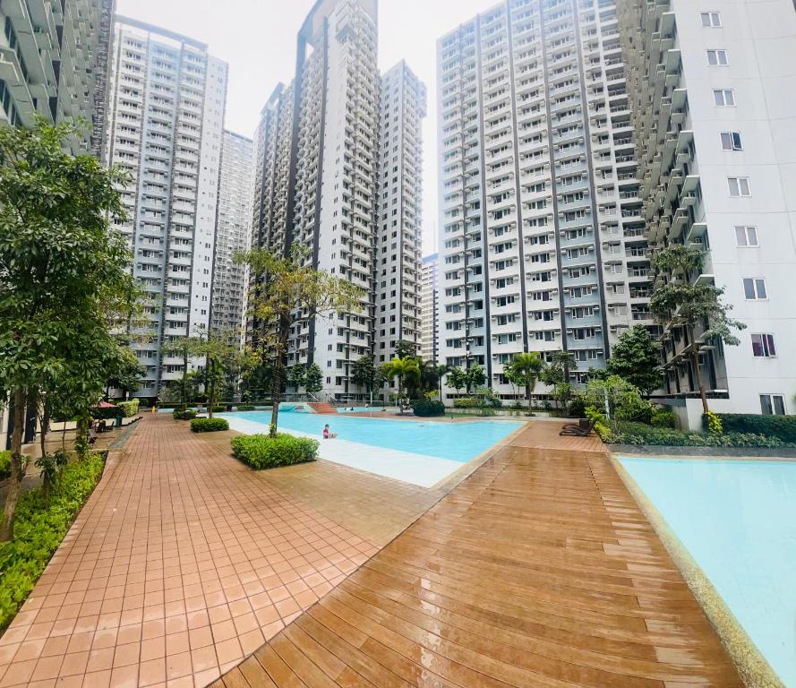 a swimming pool in a city with tall buildings at New 1BR in Mandaluyong 40SQM in Manila
