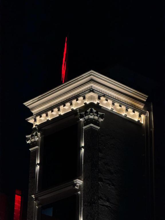 a building with a red flag on top of it at The Grand Sarayu in Mysore