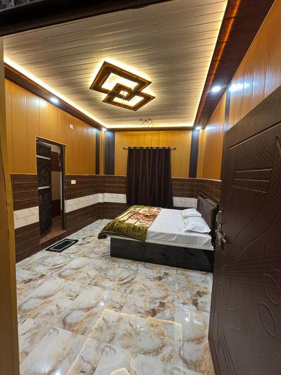 a bedroom with a bed in a room at Seeta Palace in Ayodhya
