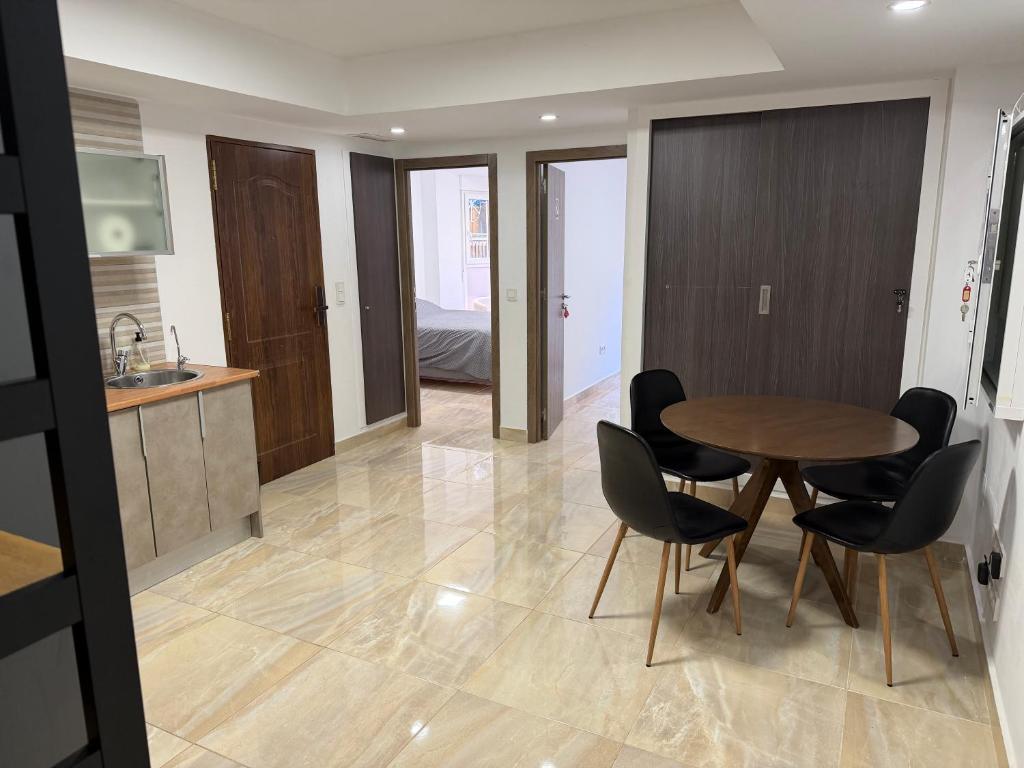a kitchen and dining room with a table and chairs at Sol y Sal in Torrevieja