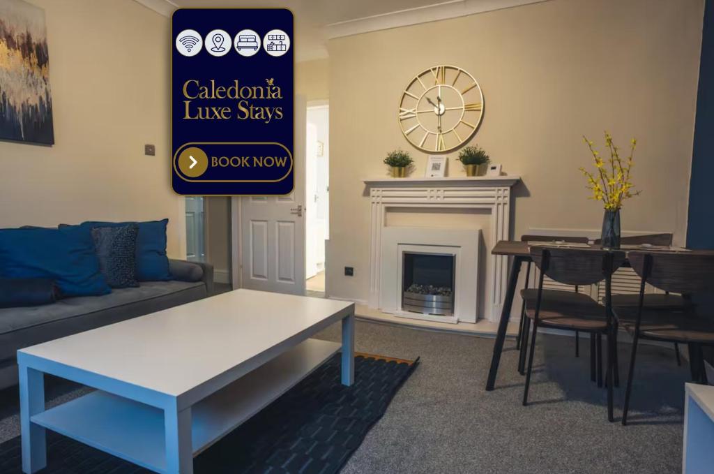 a living room with a couch and a table and a fireplace at West Apartment in Coatbridge