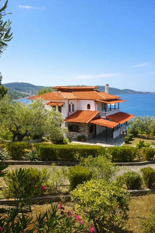 a house with a view of the ocean at Blue Dandelion in Paliouri