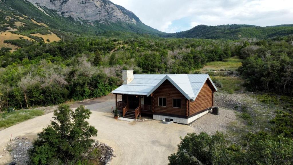 an aerial view of a cabin in the mountains at Cute Cabin with Mountain Views and King Bed in Provo