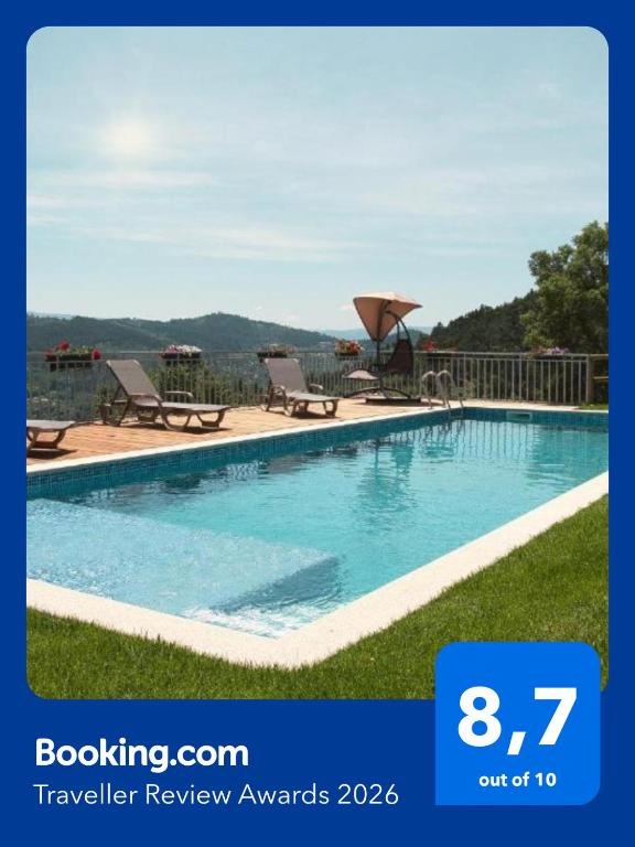 a swimming pool with two lounge chairs and a view at Casa das Oliveirinhas Bungalow by Refúgio ao Luar in Celorico de Basto