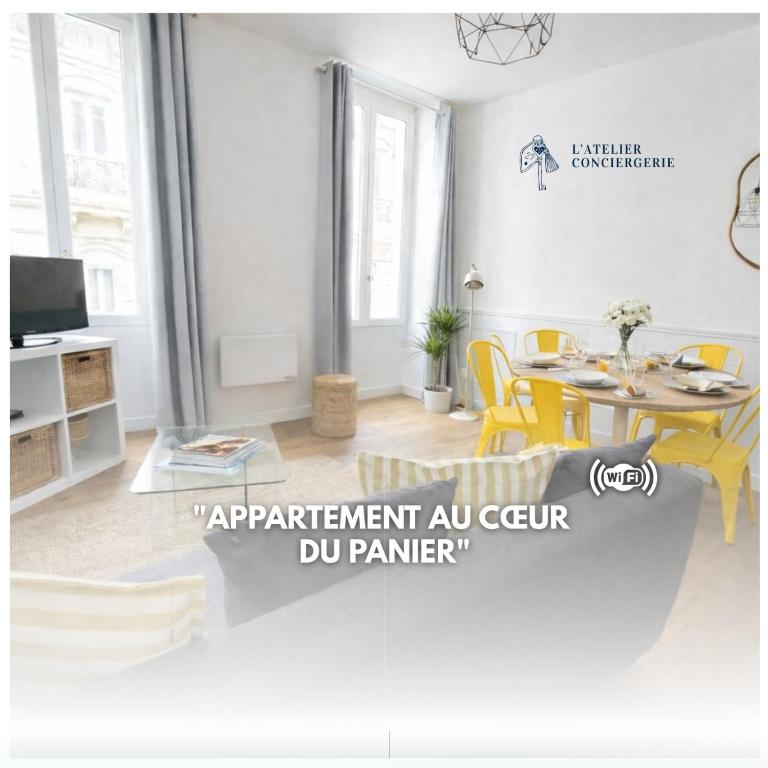 a living room with a table and yellow chairs at Appartement Marseille au cœur du panier in Marseille