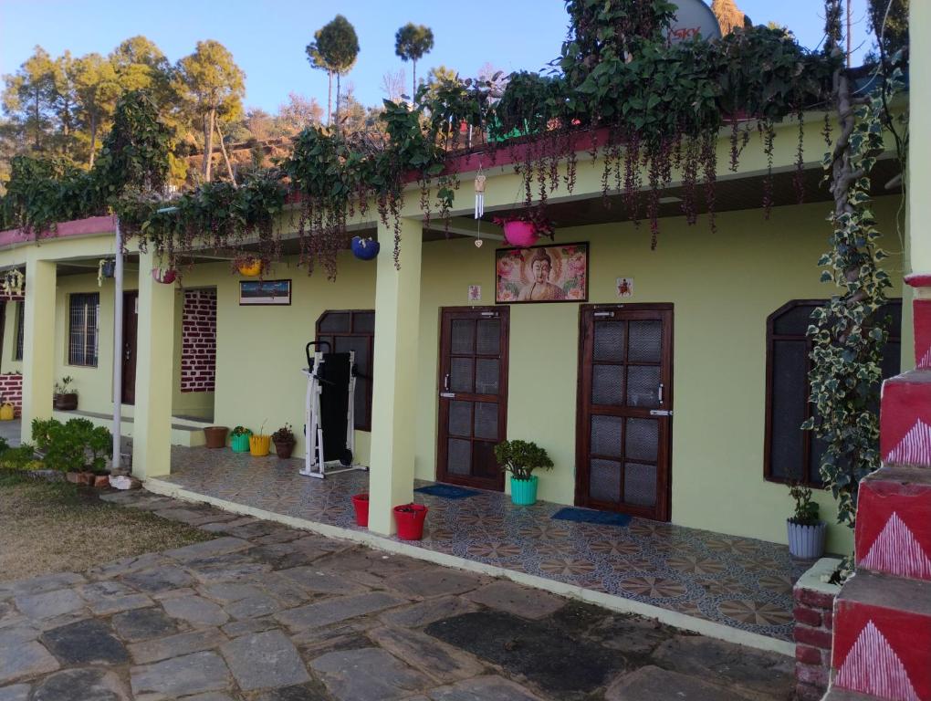a building with doors and plants on the side at The Heaven Town in Hawālbāgh