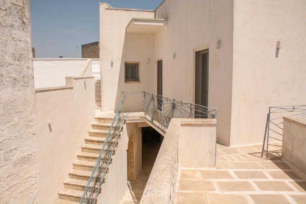 a staircase in the side of a building at Corte Sant'Oronzo in Diso